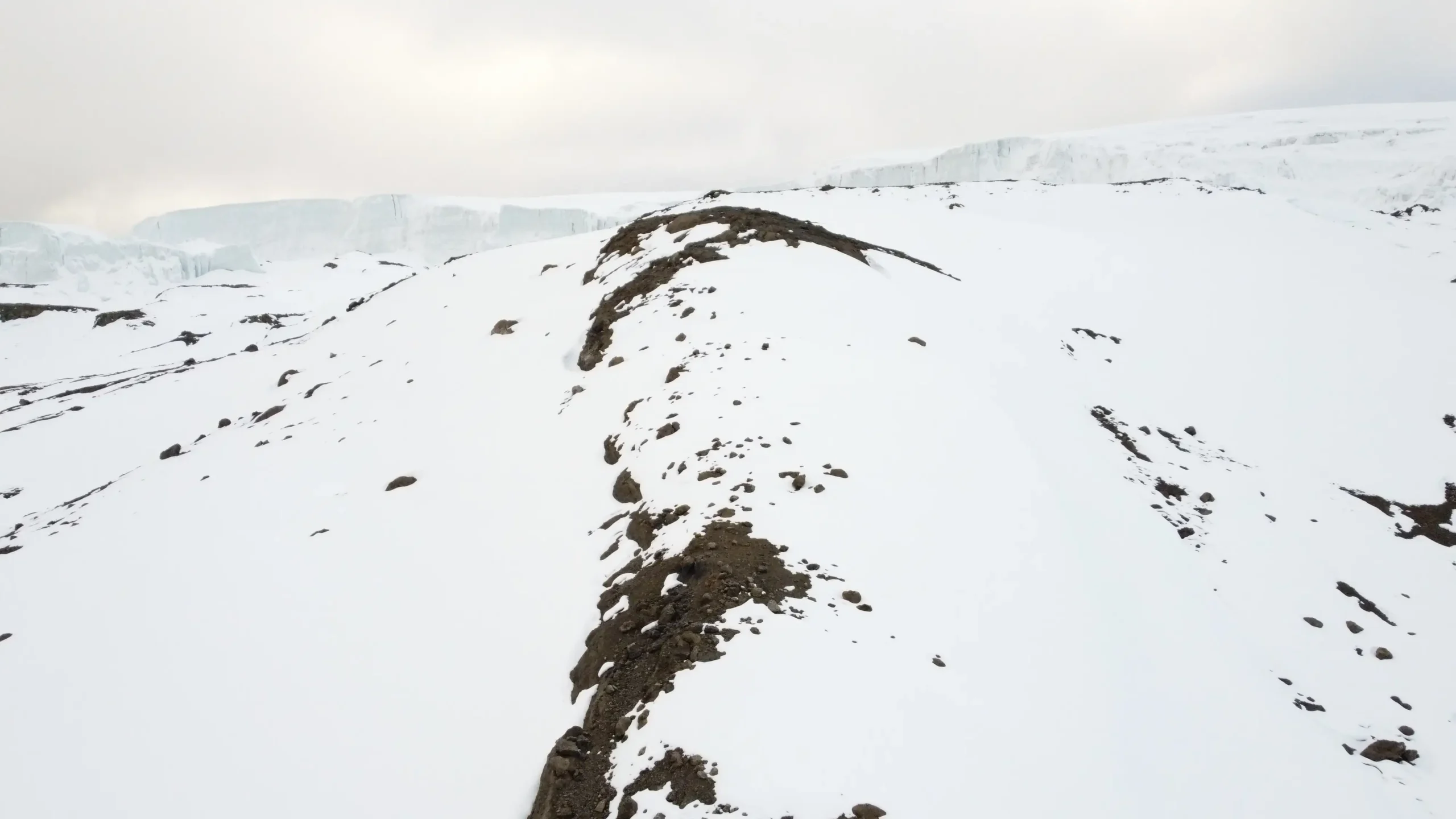 Mount Kilimanjaro glacier near Uhuru Peak, Tanzania, with snow-covered ice fields at the summit.